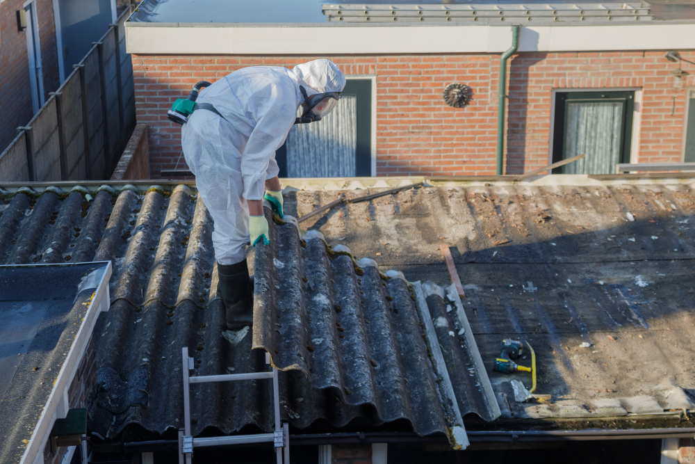 Professional asbestos removal worker in a protective suit